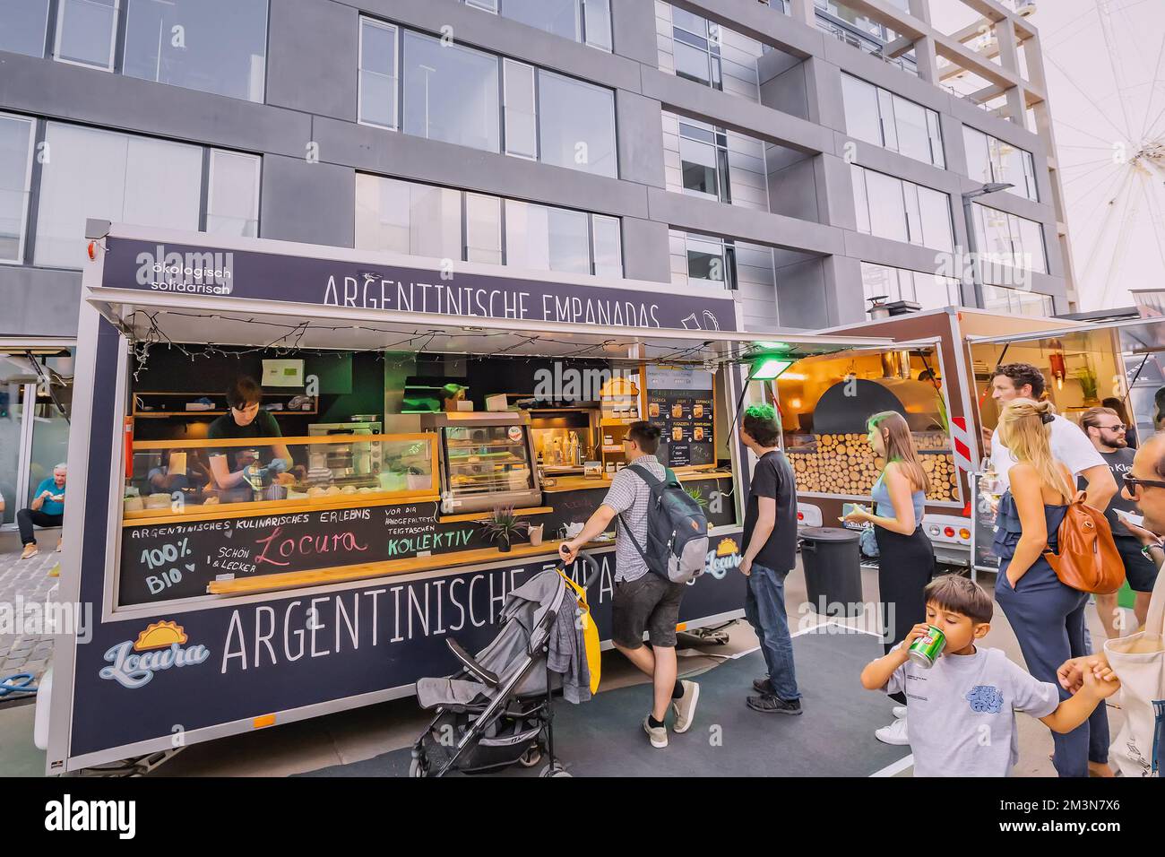 29 July 2022, Cologne, Germany: Foodtruck stall selling argentina empanadas street food cuisine at openair festival in Koln. Stock Photo