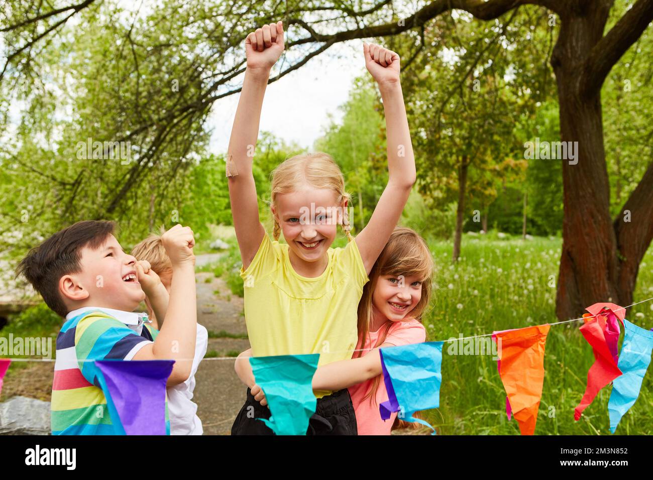 Girls and boys cheering together after winning race competition during ...