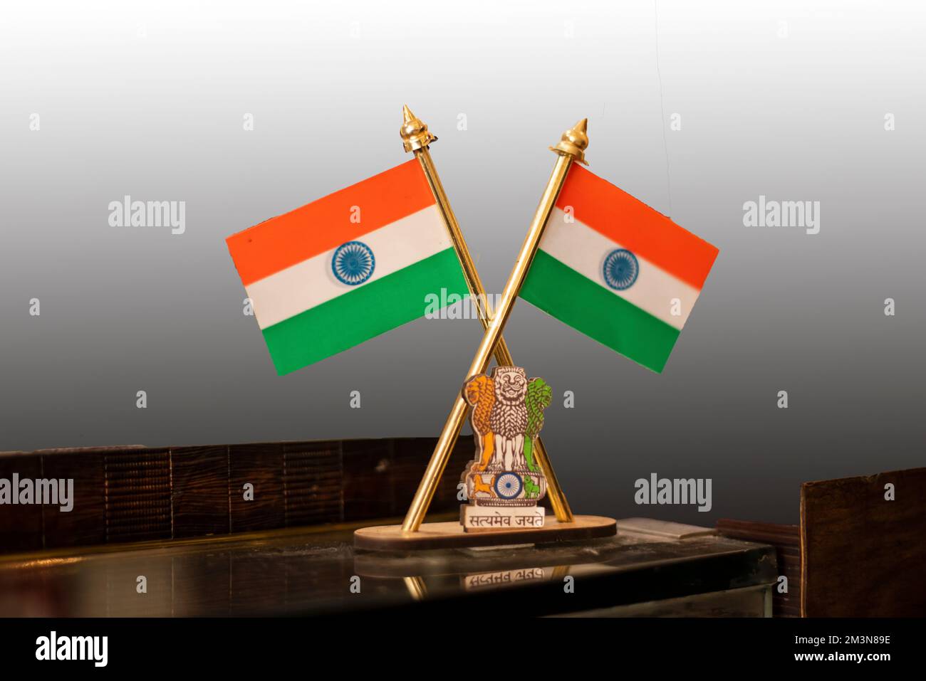 Indian flag on table against isolated grey background. Stock Photo