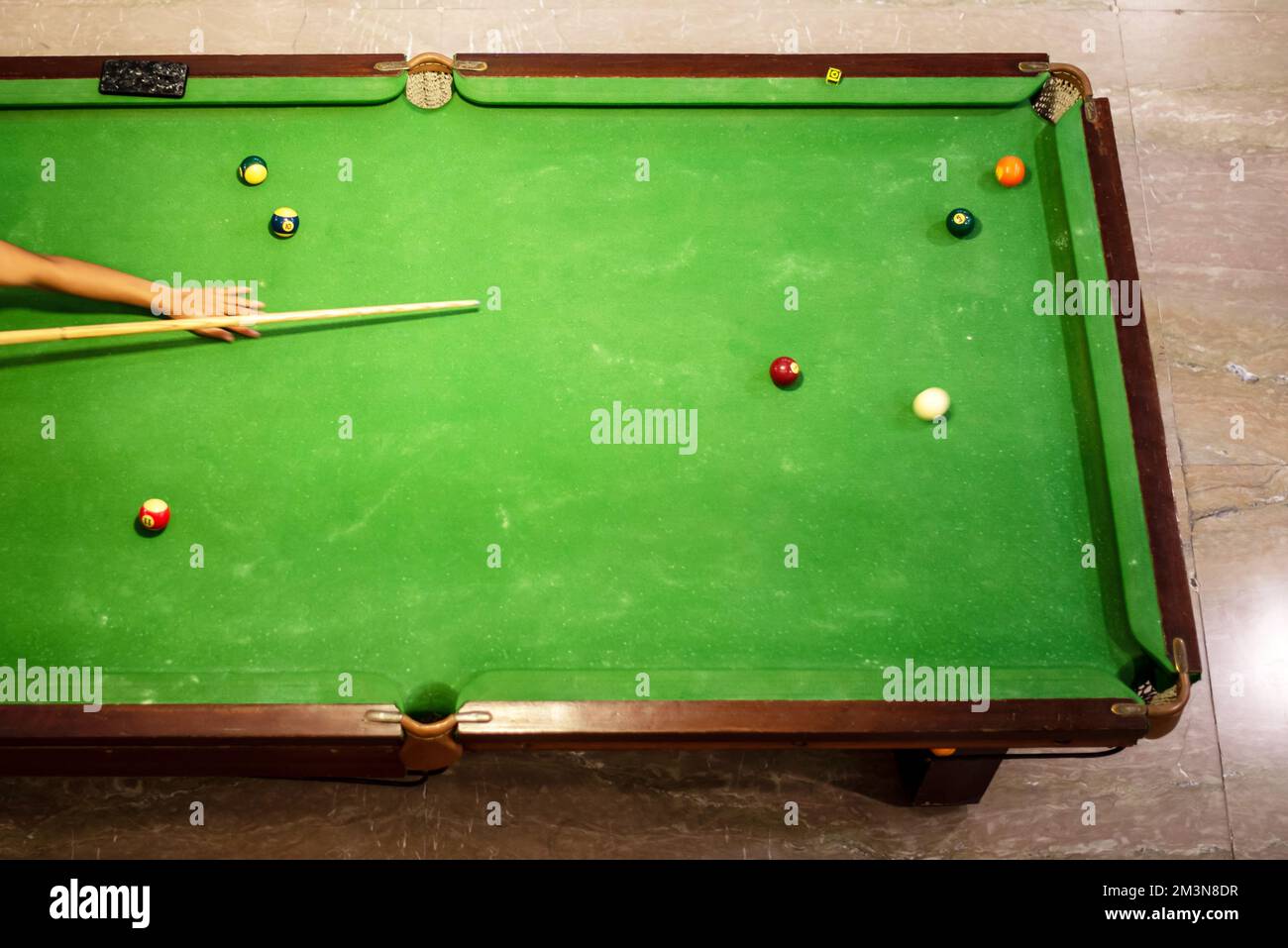 placing snooker. Cue and pool balls for pocket from top view. Stock Photo