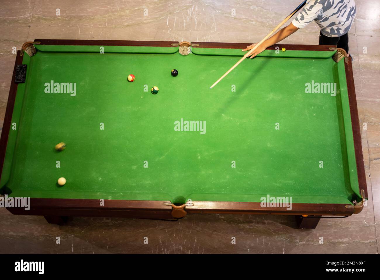 placing snooker. Cue and pool balls for pocket from top view. Stock Photo