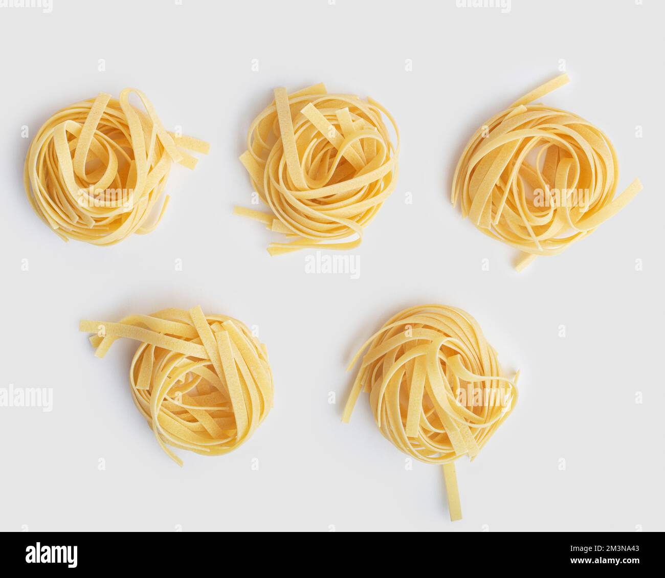 tagliatelli pasta on white background Stock Photo