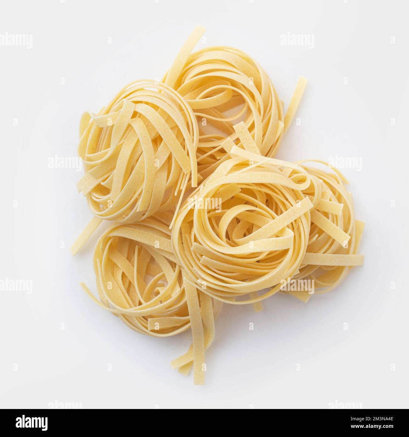 tagliatelli pasta on white background Stock Photo