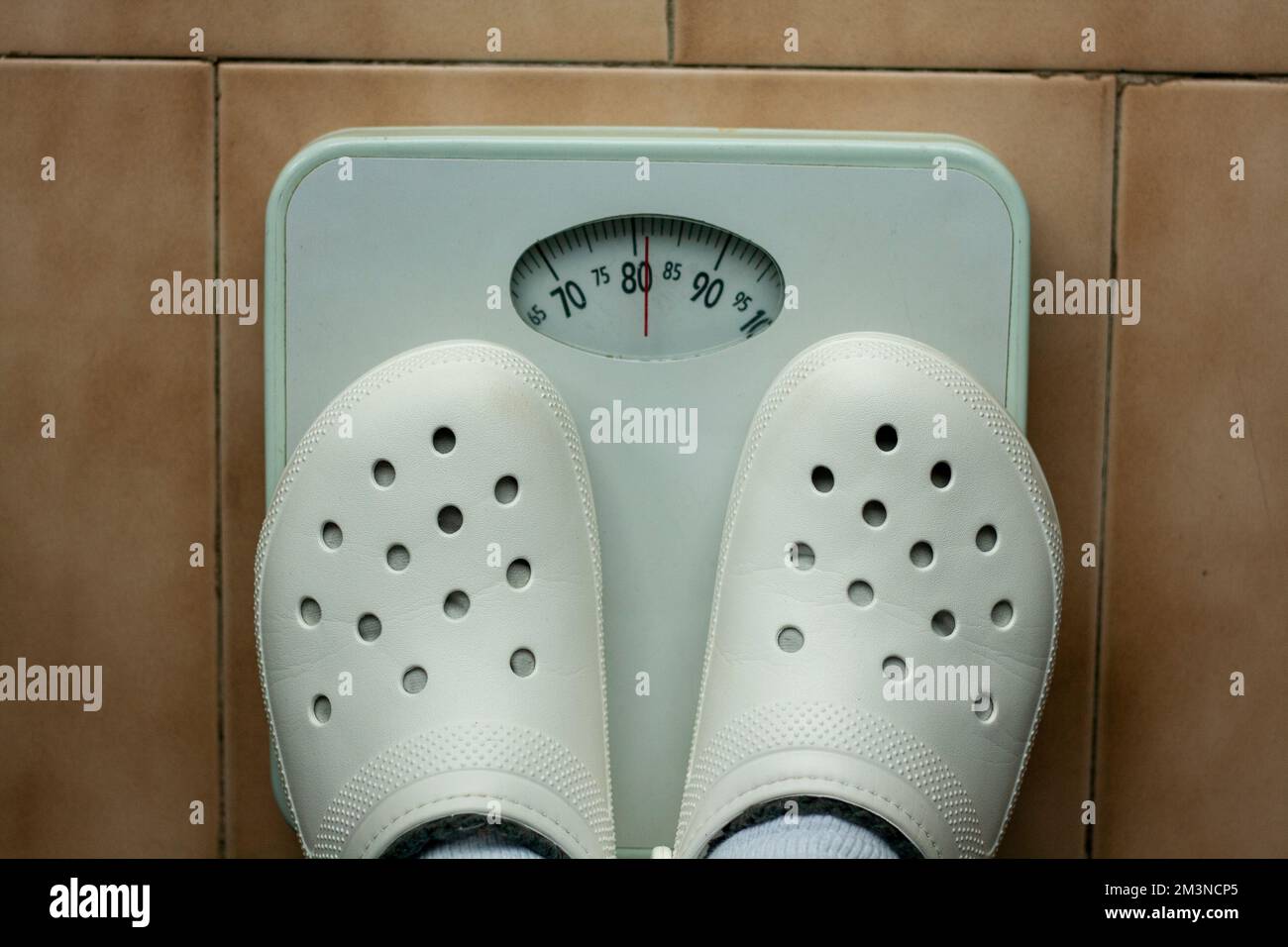 Analog scale where a person is weighed and its weight can be seen in kg