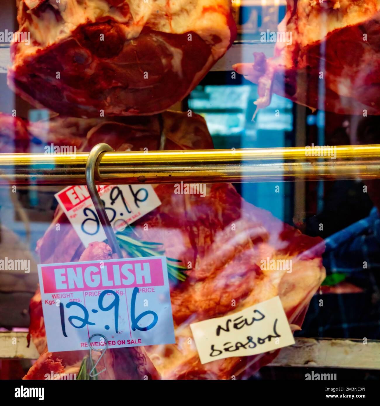 Window display of a British butcher showing various types of meat and