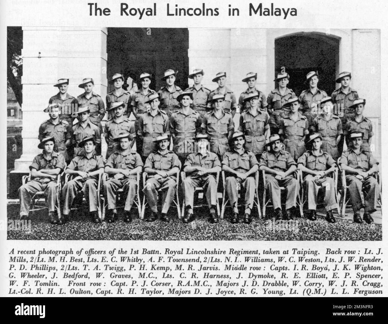 A photograph of officers of the 1st Battalion Royal Lincolnshire Regiment taken at Taiping.  Back row: Lt. J. Mills, 2/Lt. M.H. Best, Lts. E.C. Whitby, A.F. Townsend, 2/Lts N.L. Williams, W.C. Weston, Lts. J.W. Render, P.D. Phillips, 2/Lts. T.A .Twigg, P.H. Kemp, M.R. Jarvis.  Middle row: Capts. I.R. Boyd, J.K Wighton, G. Wheeler, J. Bedford, W.Graves, M.C., Lts. C.R. Harness, J. Dymoke, R.E. Elliott, E.P. Spencer, W.F. Tomlin.  Front row: Capt. P.J. Corser, R.A.M.C., Majors J.D Drabble, W.Corry, W.J.R. Cragg, Lt-Col R.H.L. Oulton, Capt. R.H Taylor, Majors D.J. Joyce, R.G. Young, Lt.(Q.M.) L.L Stock Photo