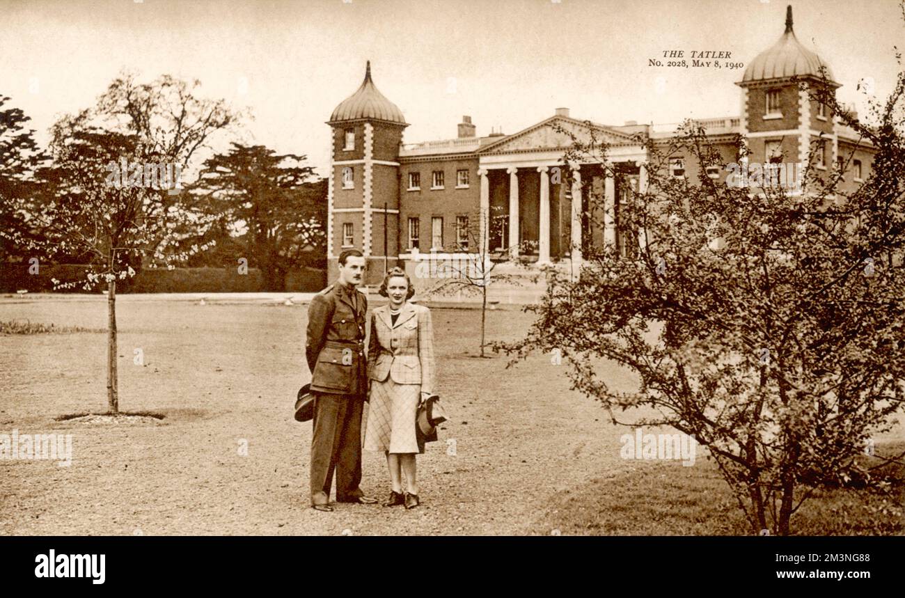 Lord and Lady Jersey (George Child Villiers, 9th Earl of Jersey and his second wife, American actress Virginia Cherrill) in Osterley Park in the suburbs of west London. Lord Jersey is home on leave and is in uniform.  May 1940 Stock Photo