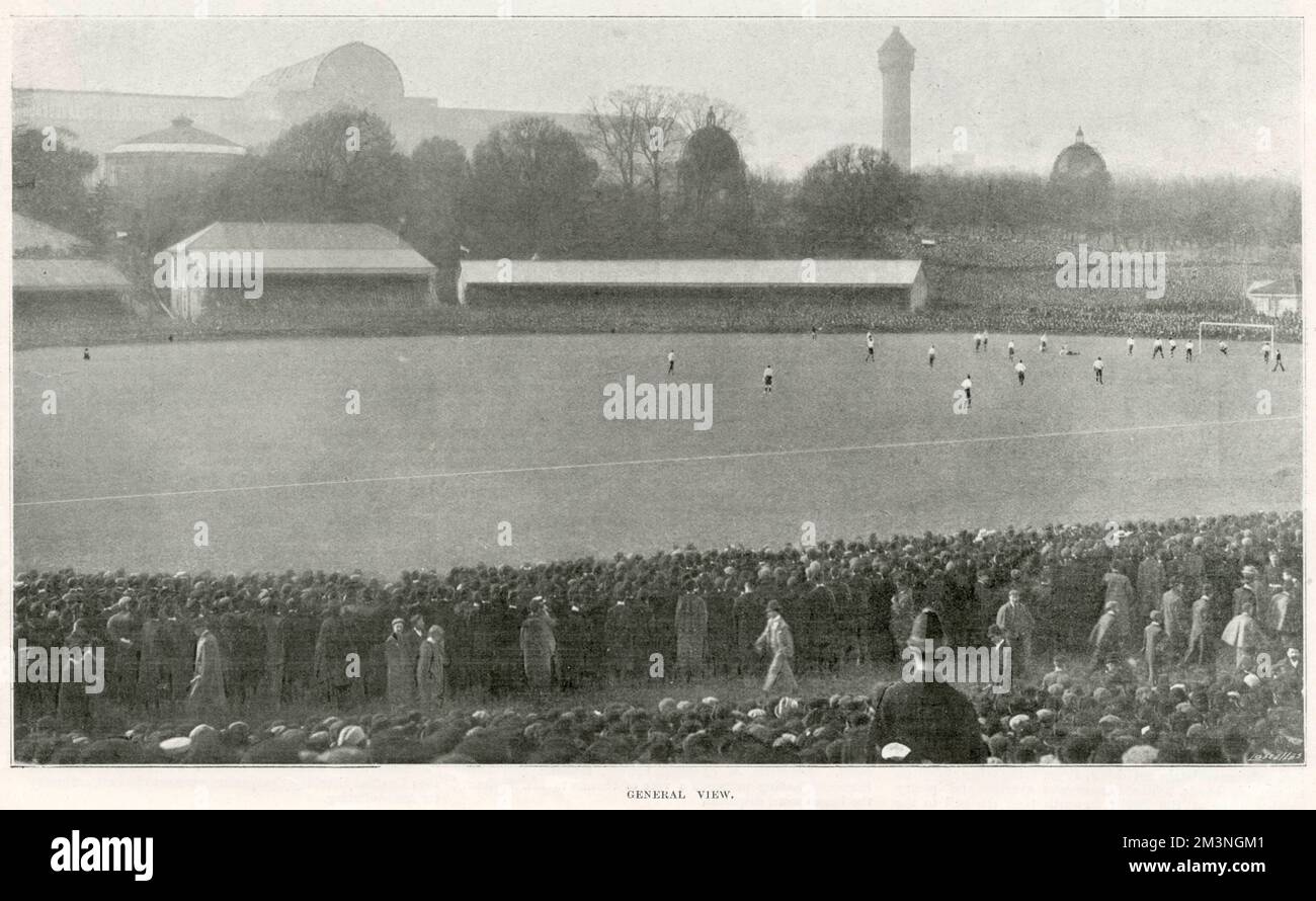 The 1899 FA Cup Final was contested by Sheffield United and Derby County at Crystal Palace, London. Sheffield United won 41, with goals scored by John Almond, Walter Bennett, Billy Beer and Fred Priest. John Boag scored Derby's goal. This picture is a general view looking over the pitch during the game, with the outline of the Crystal Palace in the background.     Date: 1899 Stock Photo