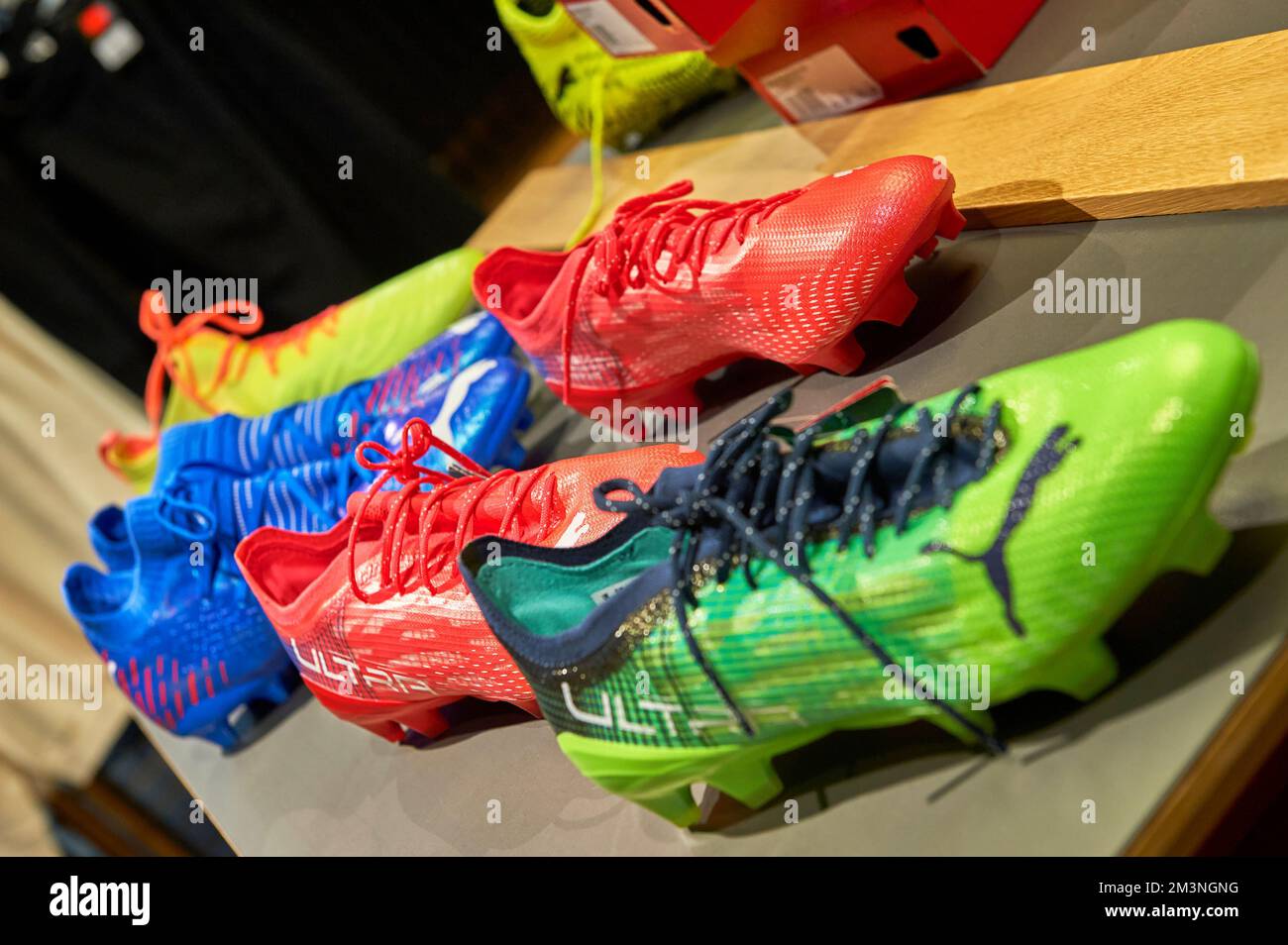 Professional football boots on sale in FC Borussia Dortmund fan shop Stock Photo