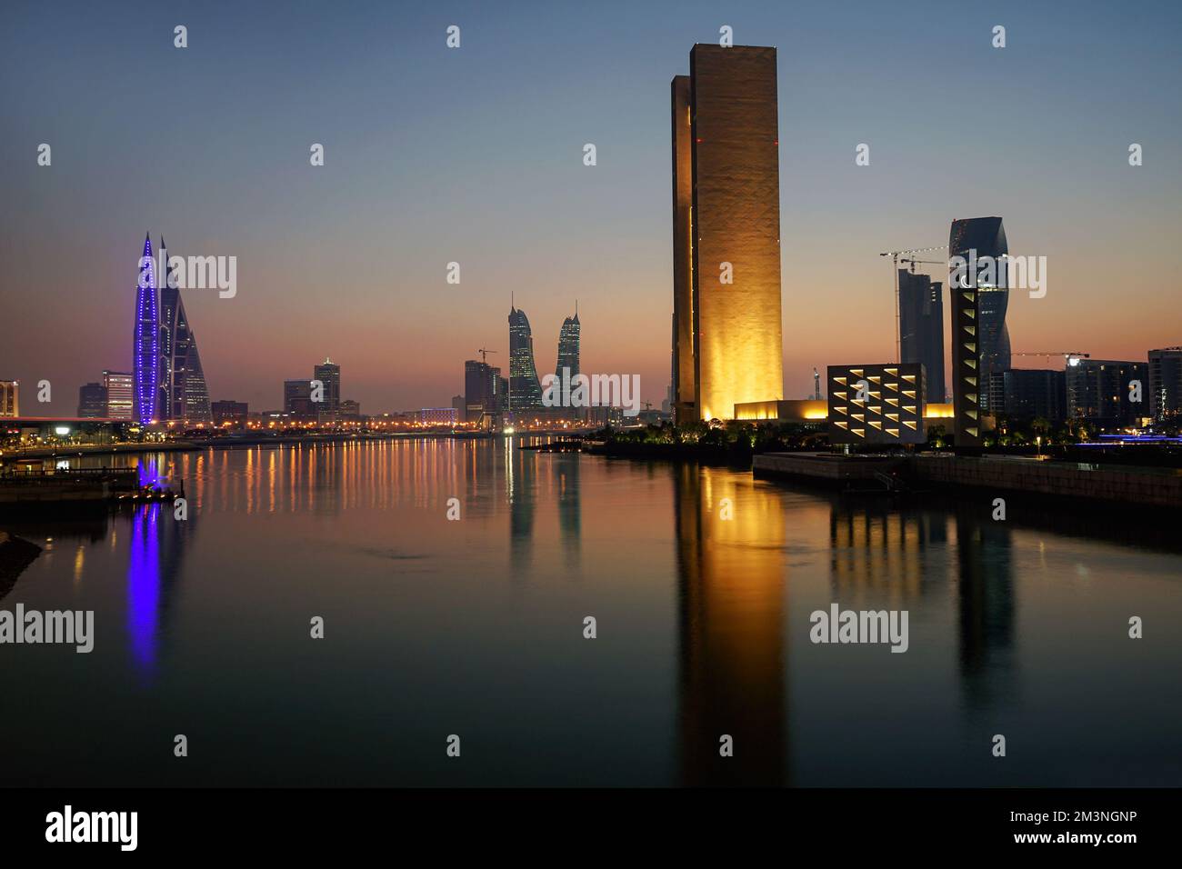 Skyline of Bahrain: World Trade Centre (left) Four Seasons Hotel and Arcapita Mosque (right), Bahrain Bay, Manama, Bahrain Stock Photo