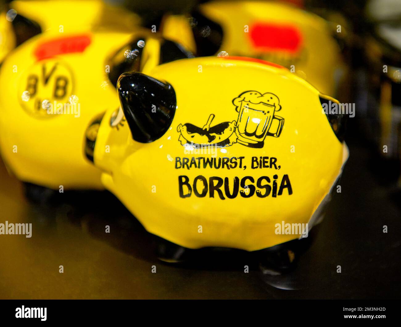 Cute piggy bank on sale in FC Borussia Dortmund fan shop Stock Photo