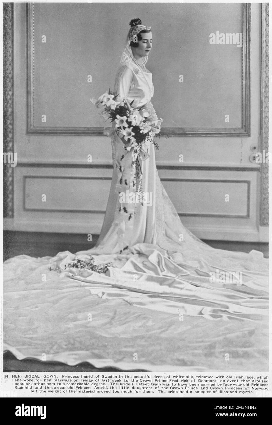 Princess Ingrid of Sweden, pictured on her wedding day to Crown Prince Frederick of Denmark.  Her dress of white silk was trimmed with old Irish lace and had an 18 foot train.  Her bouquet consisted of myrtle and lilies.  1935 Stock Photo