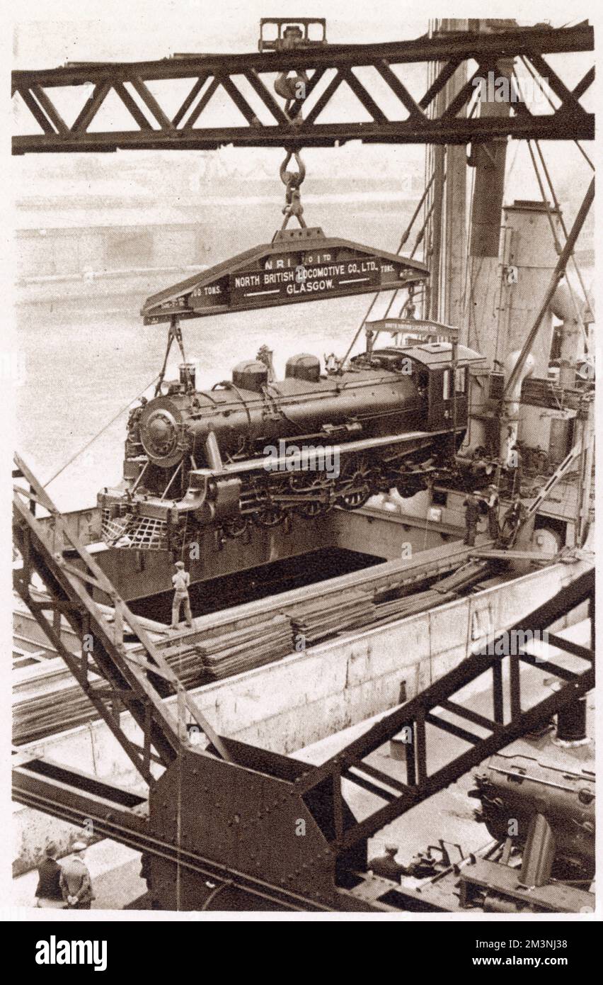 One of the eight engines built under contract by the North British Locomotive Company, Ltd, being shipped aboard the M.V Beldis. Stock Photo