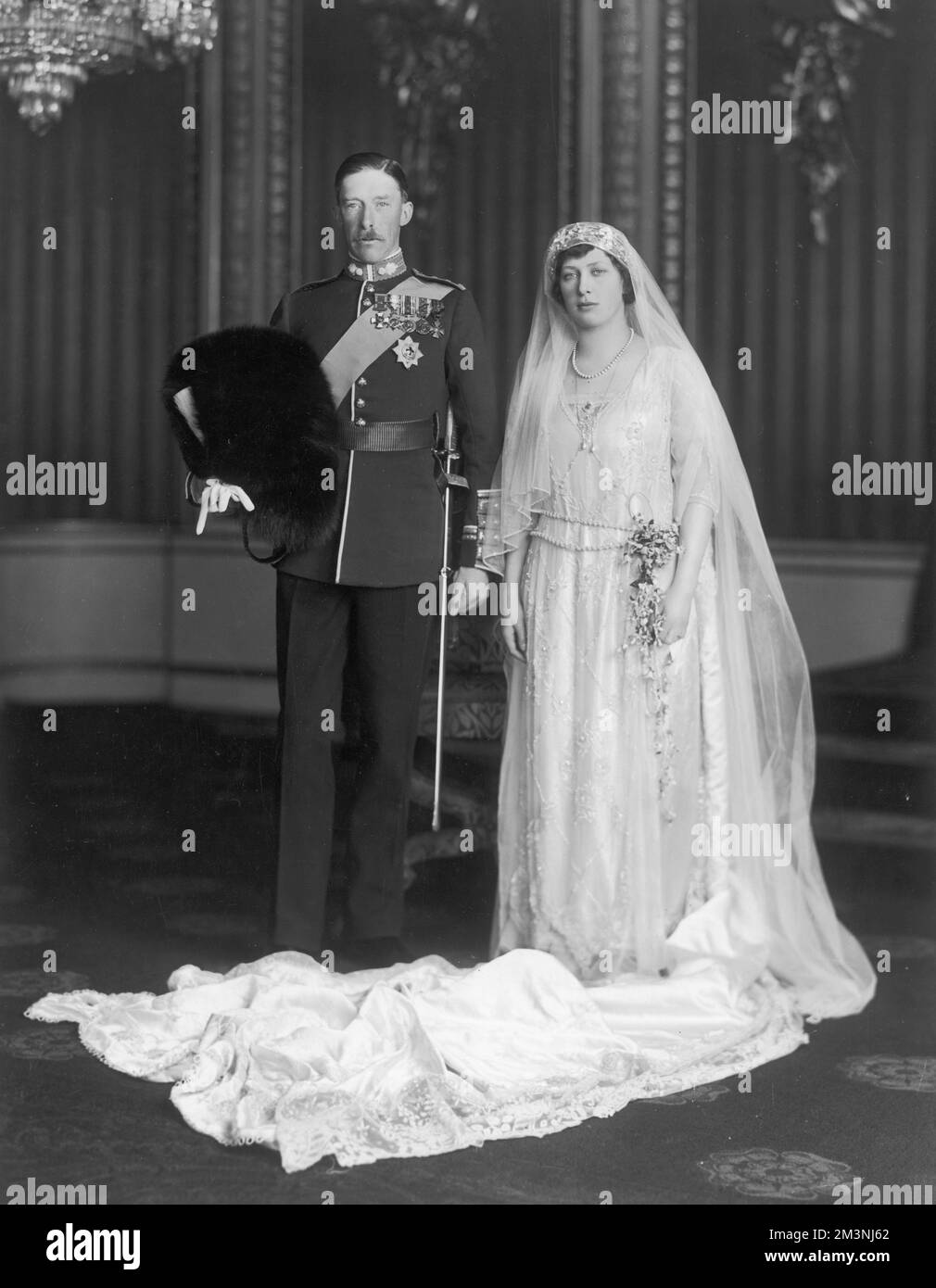 Princess Victoria Alexandra Alice Mary, the Princess Royal (1897 - 1965), Countess of Harewood, on her wedding day with her husband, Henry Charles George, Viscount Lascelles, later the Earl of Harewood (1882 - 1947).       Date: 28 February 1922 Stock Photo
