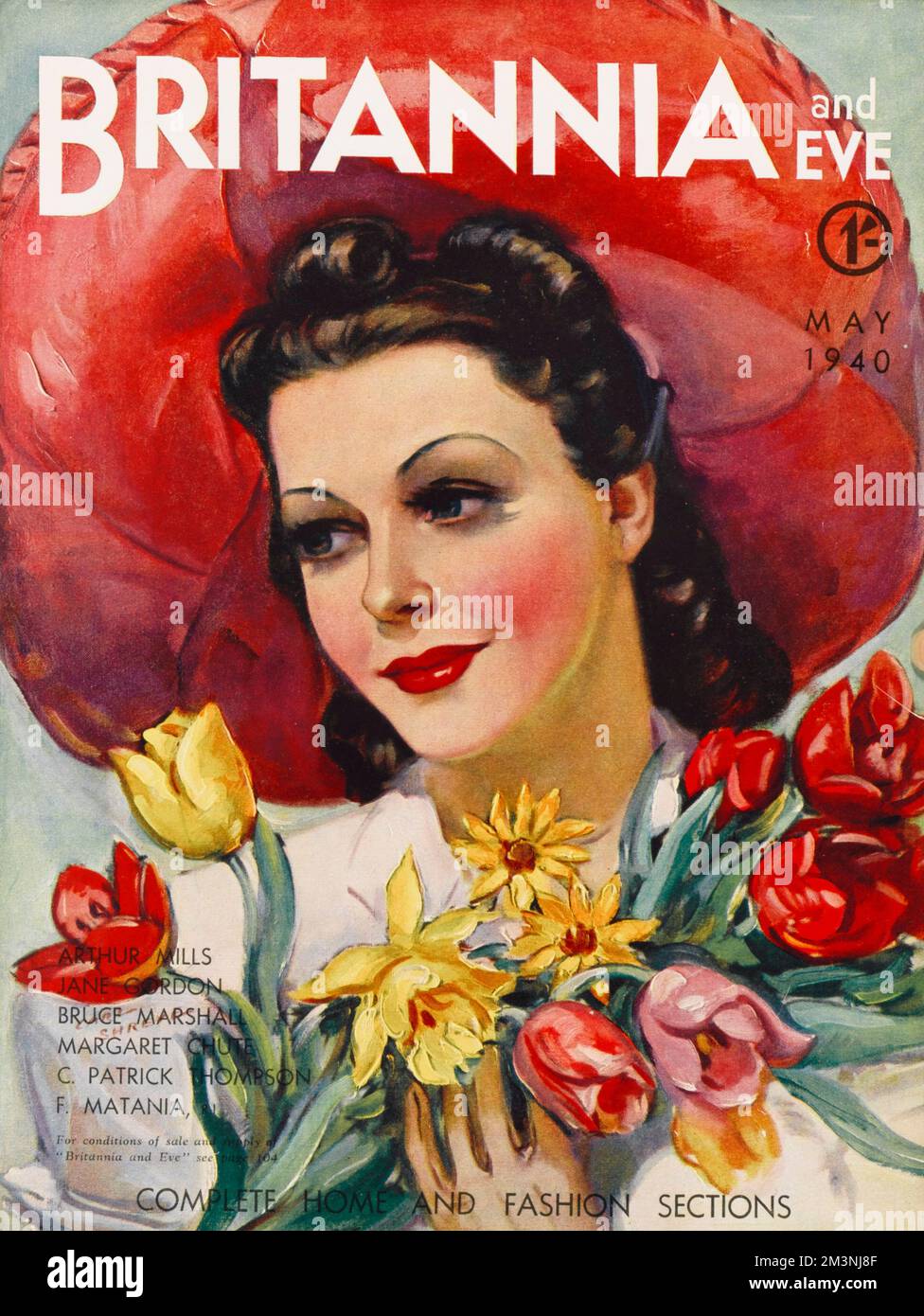 Front cover of Britannia and Eve magazine featuring a woman with glossy brown hair and red lipstick wearing a wide brimmed red sombrero style hat and holding a bunch of spring flowers.     Date: 1940 Stock Photo