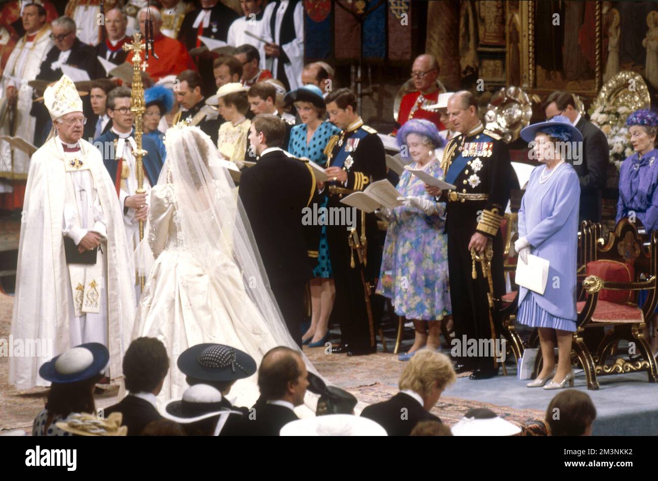 Witnessed by the royal family, Prince Andrew, Duke of York marries Sarah Ferguson at Westminster Abbey on 23 July 1986.  Archbishop of Canterbury, Robert Runcie officiates.  1986 Stock Photo