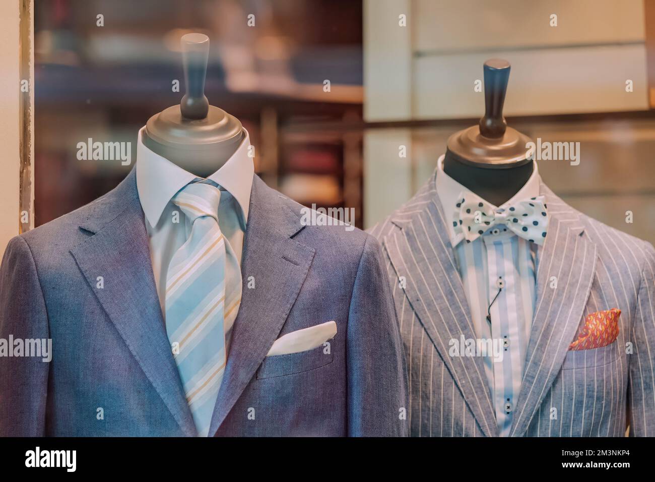 Detail of a clothing mannequin in a men suit shop with a white