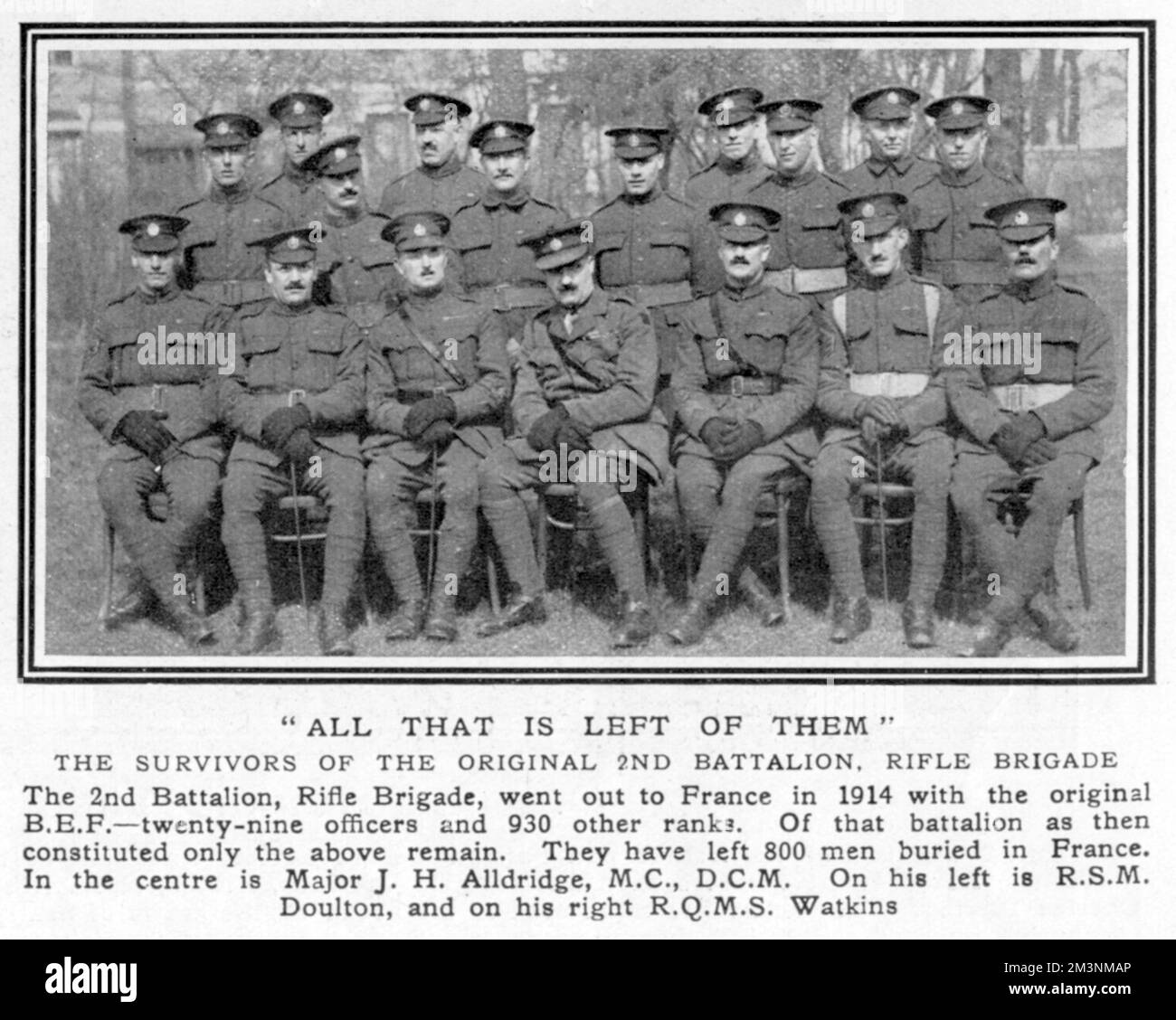 'All that is left of them', the survivors of the original 2nd Battalion, Rifle Brigade which went out to France in 1914 with the original BEF (British Expeditionary Force). They have left 800 men buried in France. In the centre is Major J H Alldridge, on his left RSM Doulton, on his right RQMS Watkins.     Date: 1919 Stock Photo