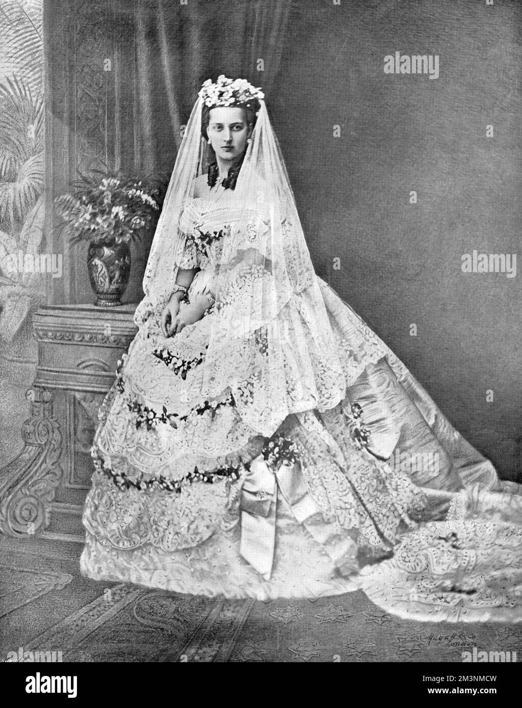 Queen Alexandra, formerly Princess Alexandra of Denmark (1844 - 1925), and then Princess of Wales, consort of King Edward VII pictured in her wedding gown for her marriage to Albert Edward, Prince of Wales on 10 March 1863 at St. George's Chapel, Windsor.     Date: 1863 Stock Photo