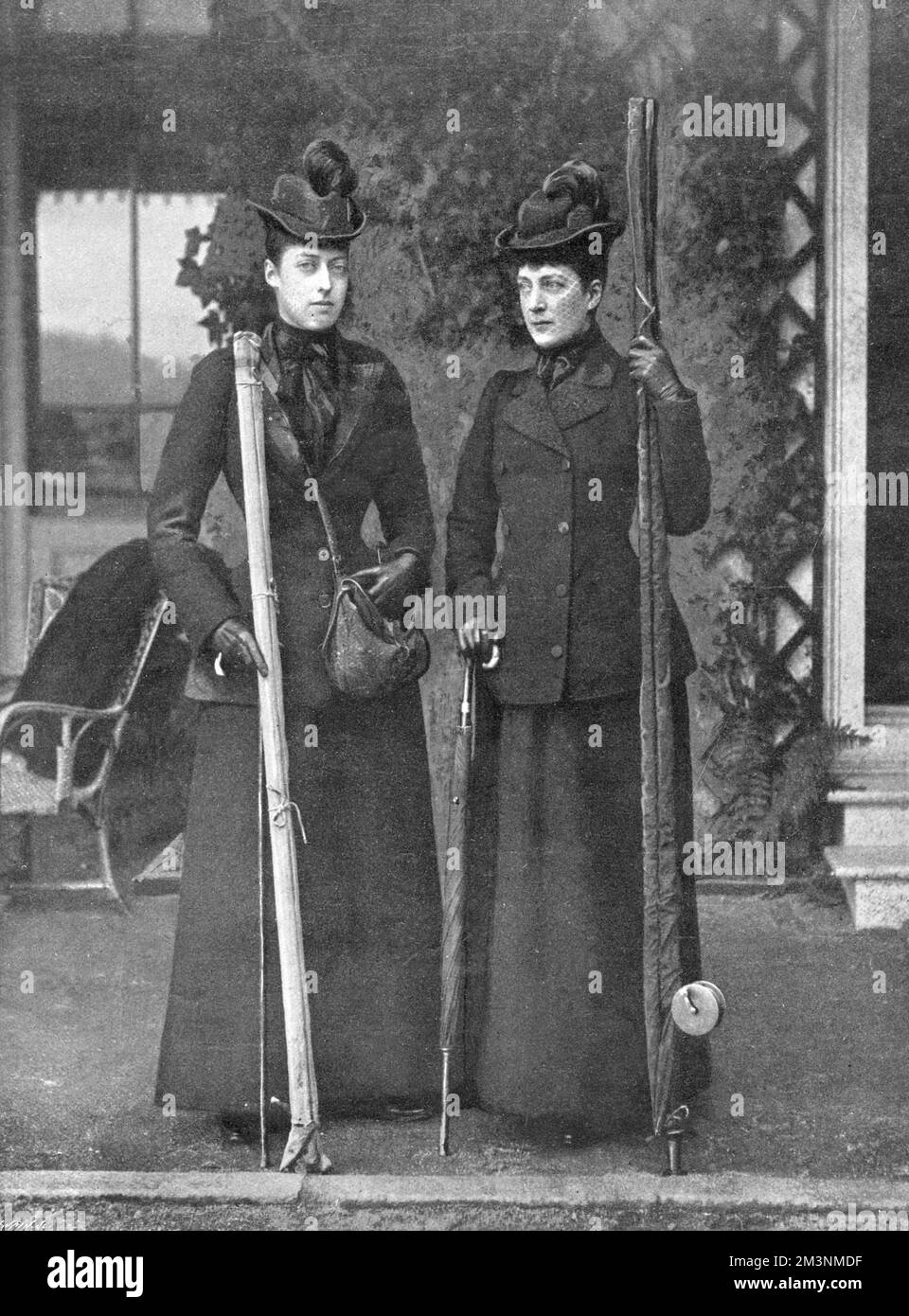 Queen Alexandra (1844 -1901), pictured with her middle daughter and companion, Princess Victoria of Wales (1868 - 1935), known as Toria by the family, both of them holding angling equipment.     Date: c.1900 Stock Photo