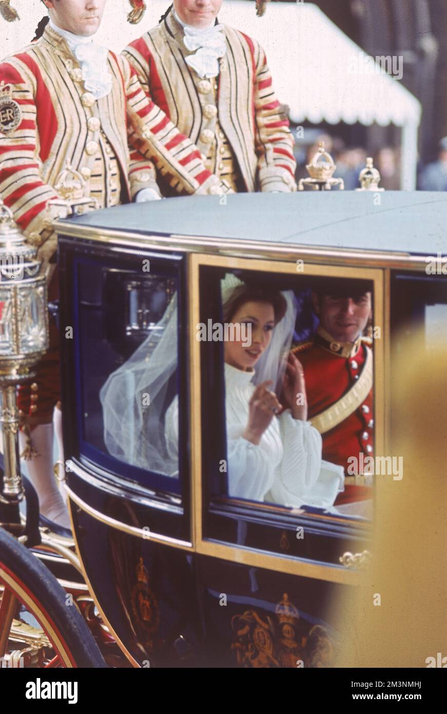 The Marriage of Princess Anne to Mark Phillips, a Lieutenant in the 1st Queen's Dragoon Guards, at Westminster Abbey on 14th November 1973. The couple leave the Abbey in a horse-drawn carriage.     Date: 1973 Stock Photo