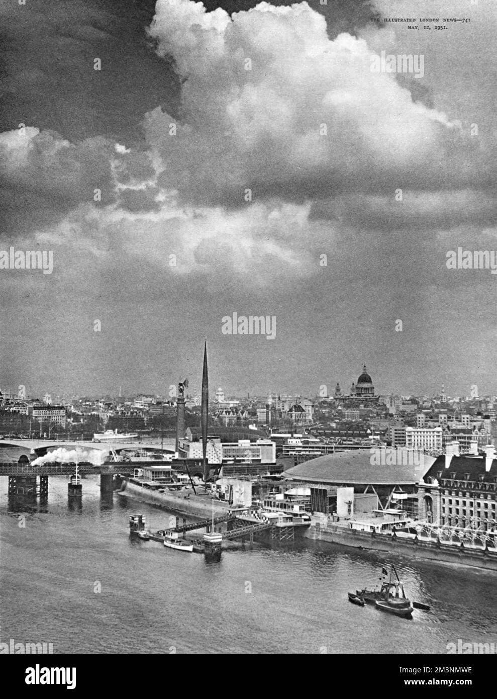General view of the Festival of Britain site, South Bank, London, looking down the River Thames from Big Ben.  From the right can be seen County Hall, the Dome of Discovery, the Sea and Ships Pavilion facing the Nelson Pier, the Charoux bas relief sculpture 'The Islanders', the Skylon, and the Festival Hall and old Shot Tower just beyond Hungerford Bridge.  In the distance can be seen St Paul's Cathedral, where the service of dedication was held.     Date: early 1951 Stock Photo