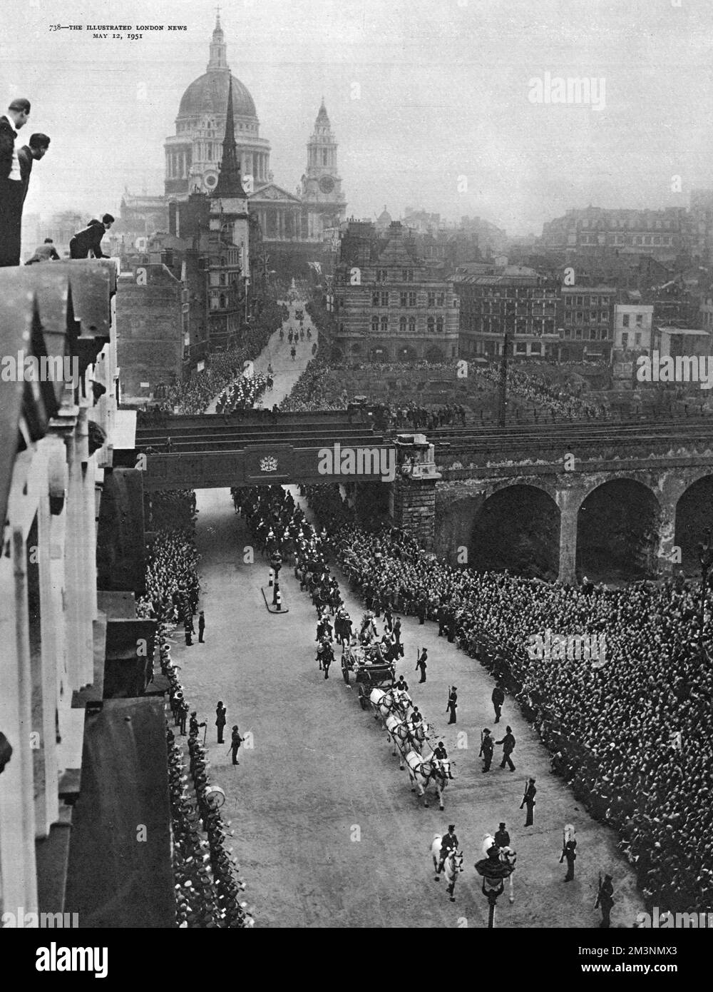 The royal procession leaving St Paul's Cathedral, London, returning to Buckingham Palace after the service of dedication and official opening of the Festival of Britain.  In the open carriage are King George VI, Queen Elizabeth and Princess Margaret.  Crowds line the road along both sides of Ludgate Hill, all the way down to Ludgate Circus and beyond.  A few people can be seen on the left, standing on the roof of an office building.     Date: 3 May 1951 Stock Photo