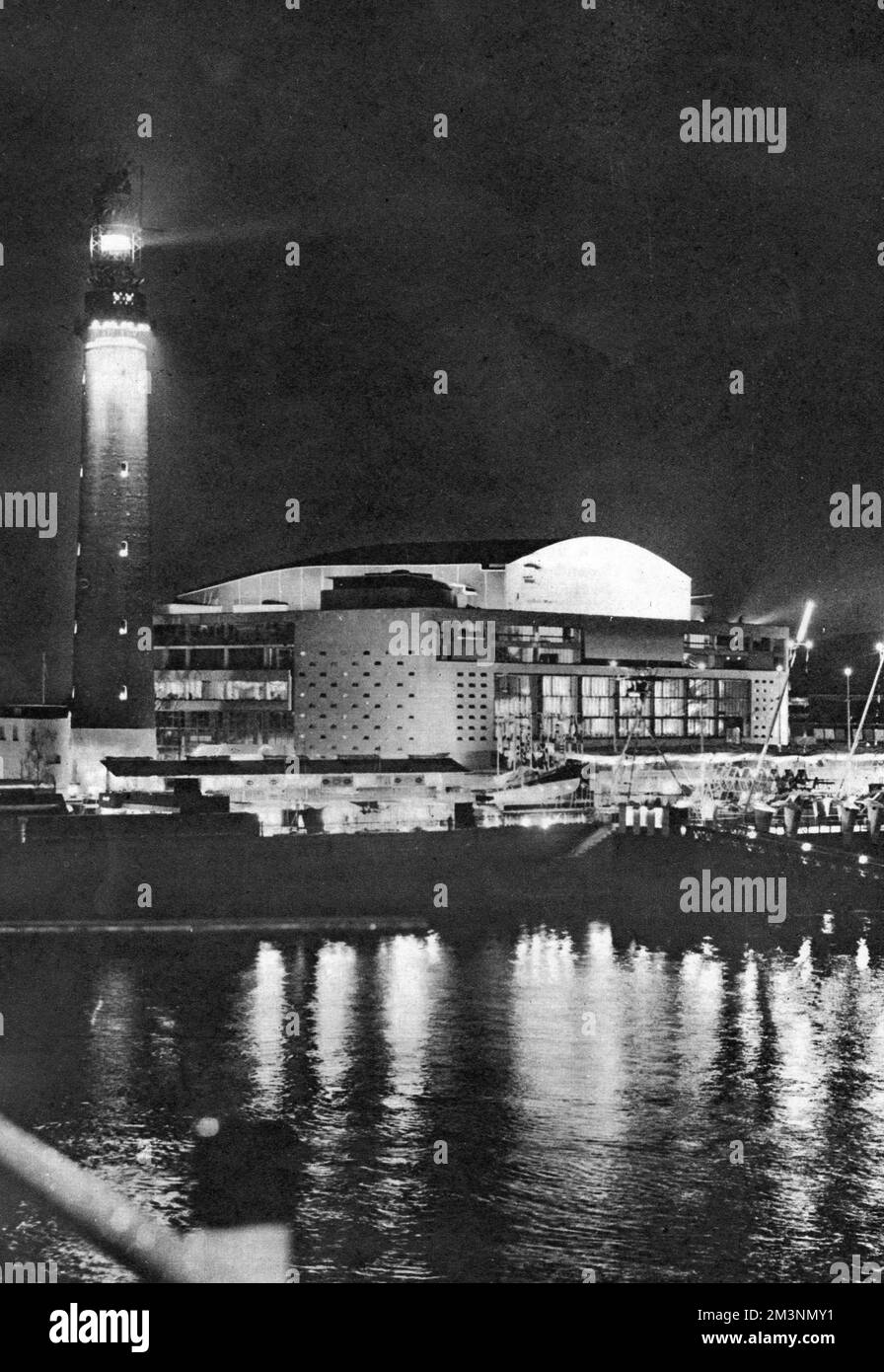 View by night of the newly opened Royal Festival Hall on the South Bank, London, with the old Shot Tower on the left, seen here at the time of the Festival of Britain exhibition.       Date: early 1951 Stock Photo