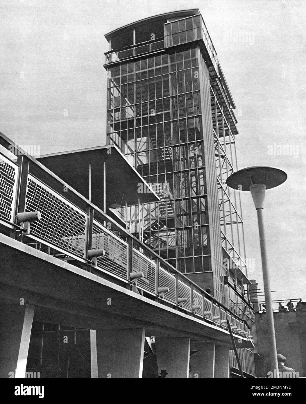 View of the Glass Tower by Waterloo Bridge, at the Festival of Britain exhibition on the South Bank, London.  The tower was made of steel and glass, and contained a lift, a stairway and a series of platforms, allowing for panoramic views of London, as well as a bird's eye view of the exhibition itself.       Date: early 1951 Stock Photo