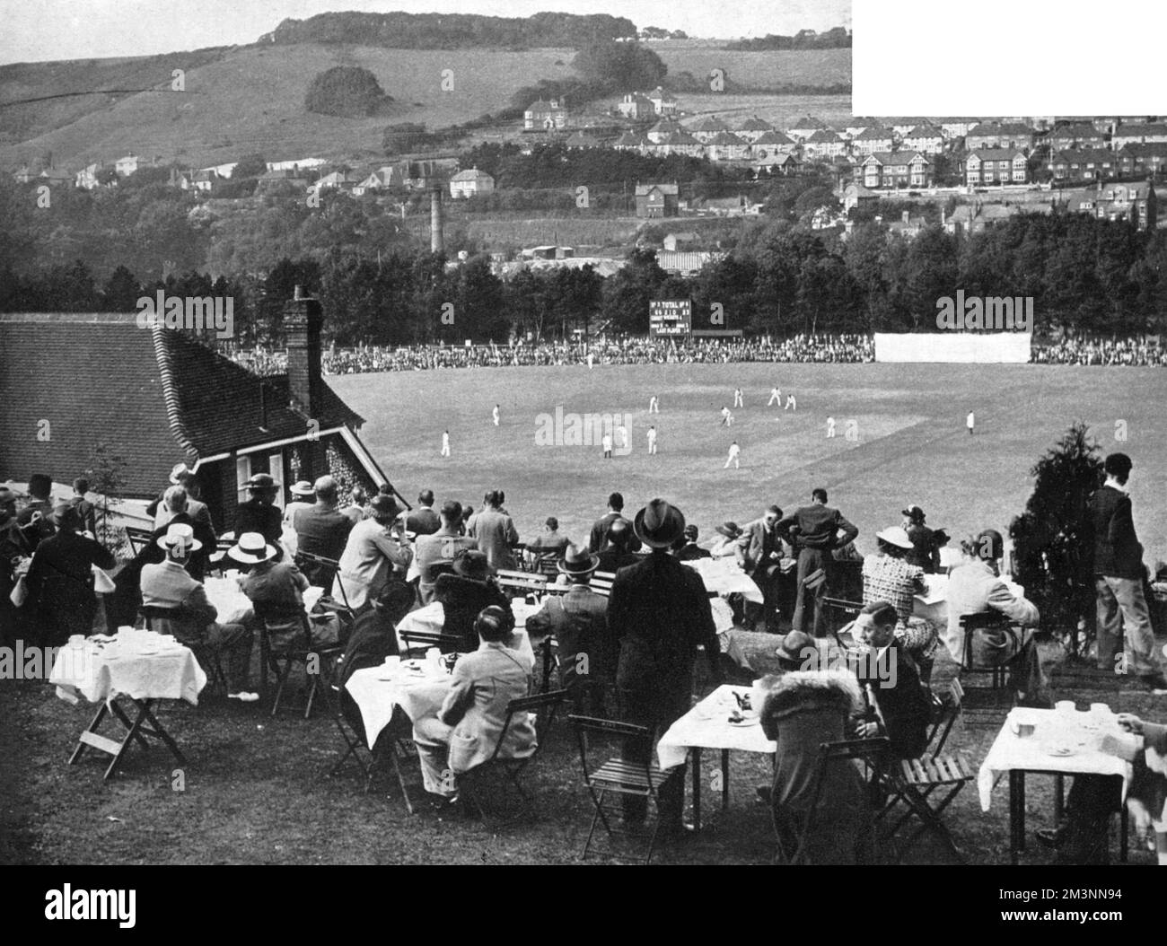 The lovely Crabble cricket ground at Dover, Kent, which was used by Kent County Cricket Club from 1907 to 1976. The match in progress is between Kent and Yorkshire, which was won easily by the visitors who went on to win the County Championship that season. Stock Photo