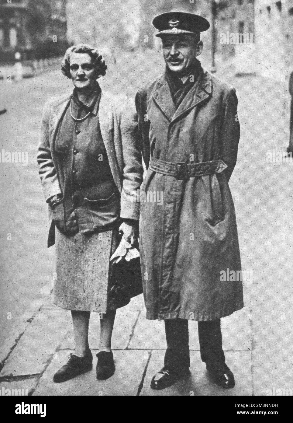 Air Chief-Marshal Sir Robert Brooke-Popham, pictured with his wife in London following their return from the Far East. Formerly the British Commander-in-Chief of the Far East command, Brooke-Popham had stepped down from the post at the end of 1941. He and his wife arrived back in Britain shortly before the Japanese advance resulted in the fall of Singapore on 15 February 1942.     Date: February 1942 Stock Photo