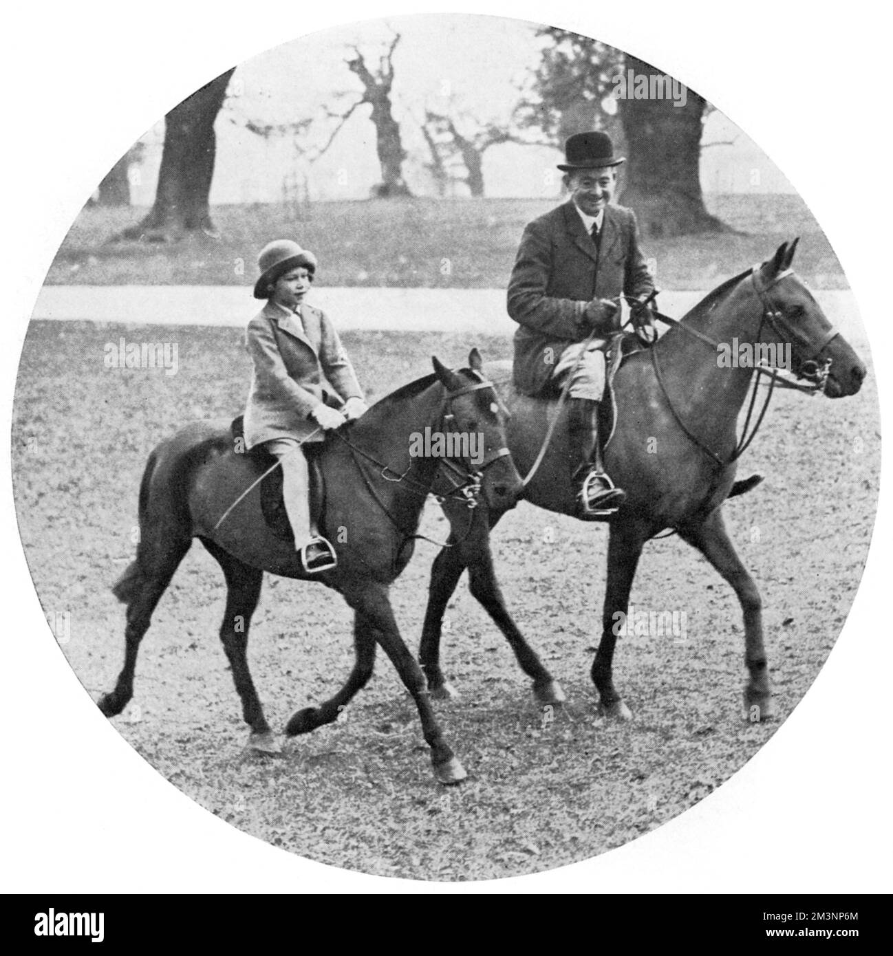 Princess Elizabeth rides in Windsor Great Park under the supervision of Mr Owne, the Duke of York's Royal Groom.       Date: 1934 Stock Photo