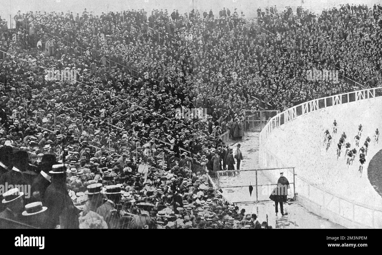 50,000 spectators witnessing the 100 kilometres cycle race. Up until this point, the events had been poorly attended, with thousands of seat unfilled each day. However, a lowering of ticket prices caused a surge in interest, and stands started to fill up.      Date: 1908 Stock Photo