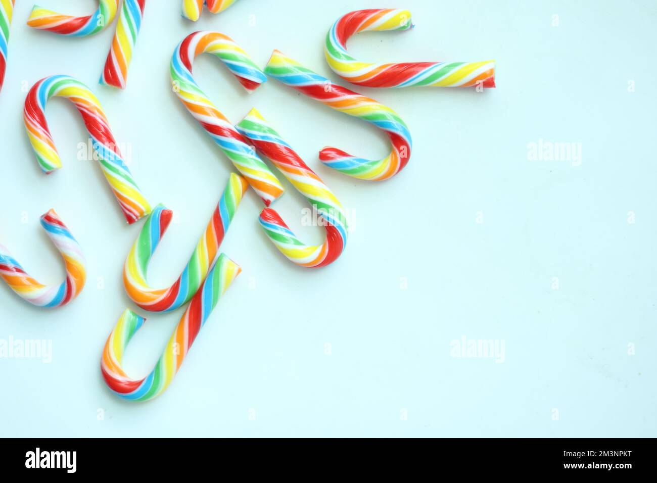 mini cherry candy canes on white background  Stock Photo