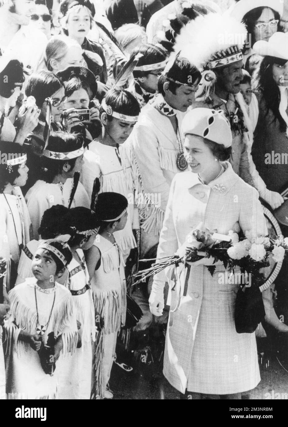 Queen Elizabeth II meeting local Indian tribes during a royal tour of British Columbia in Canada as part of the centenary celebrations in June 1971.       Date: 1971 Stock Photo