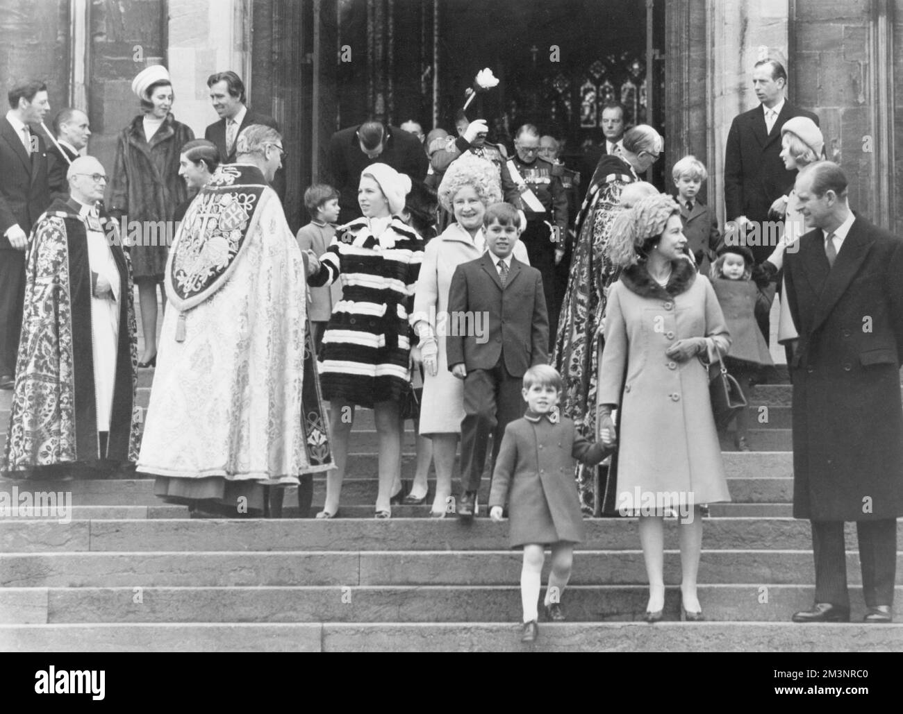 Members of the Royal family leave St. George's Chapel, Windsor after attending the Christmas service there.  In the foreground is Queen Elizabeth II holding the hand of her youngest son, Prince Edward (Earl of Wessex) as she talks to her husband, Prince Philip, Duke of Edinburgh.  Behind Prince Edward is Prince Andrew (Duke of York) with his grandmother, Queen Elizabeth the Queen Mother while his sister, Princess Anne shakes hands with an unidentified prelate.  At top far left is Angus Ogilvy with his wife Princess Alexandra of Kent who is talking to Lord Snowdon.  Next to Snowdon is his won, Stock Photo