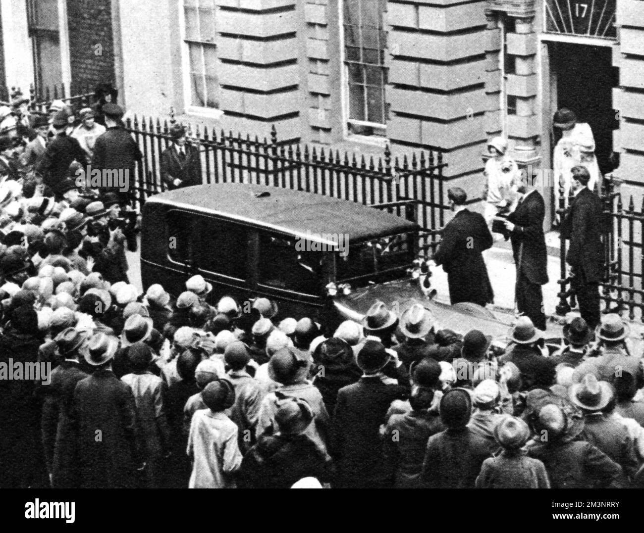 The Duchess of York (later Queen Elizabeth, the Queen Mother) leaving