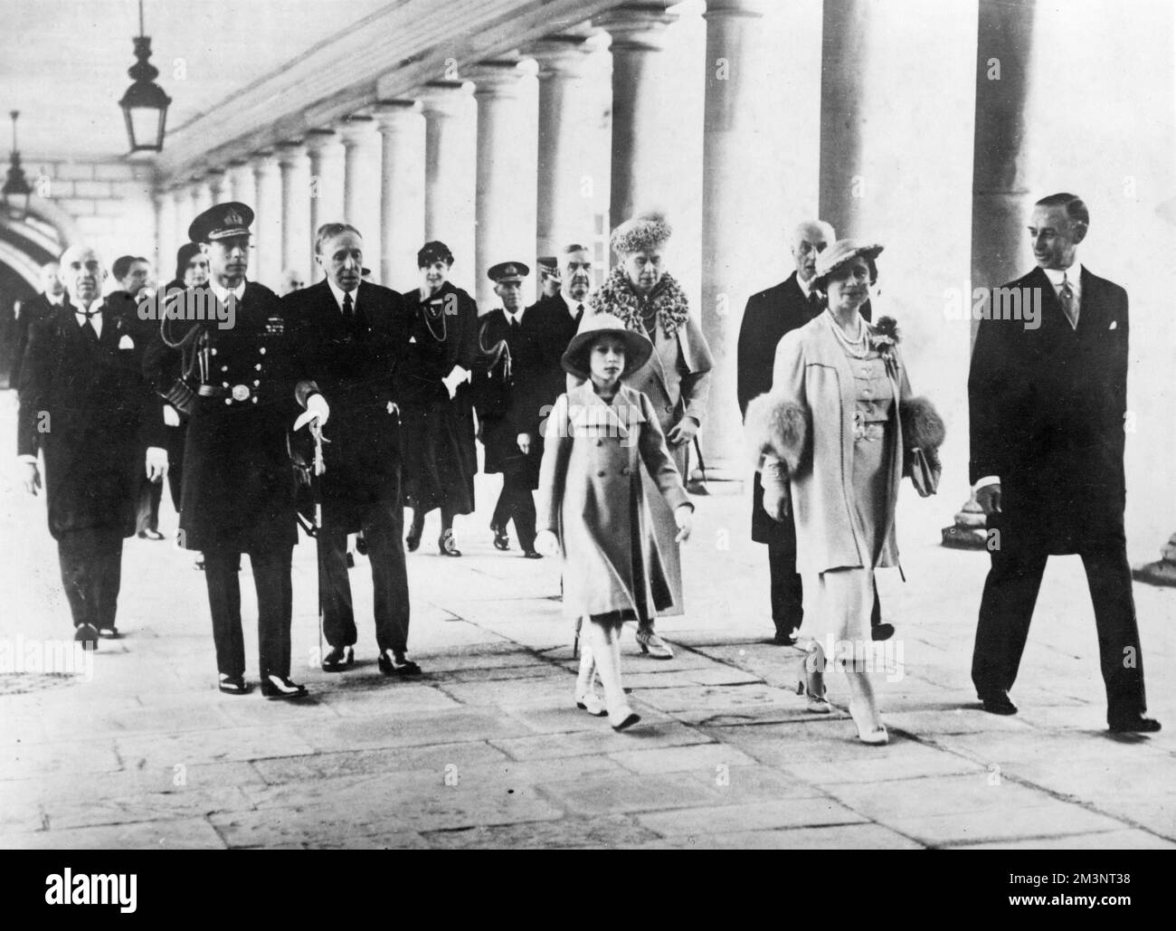 King George VI, Queen Elizabeth, Princess Elizabeth (later Queen Elizabeth II) and Queen Mary arriving at the National Maritime Museum in Greenwich, south east London, for its official opening on 27 April 1937.  They had travelled there by barge on the River Thames.      Date: 1937 Stock Photo