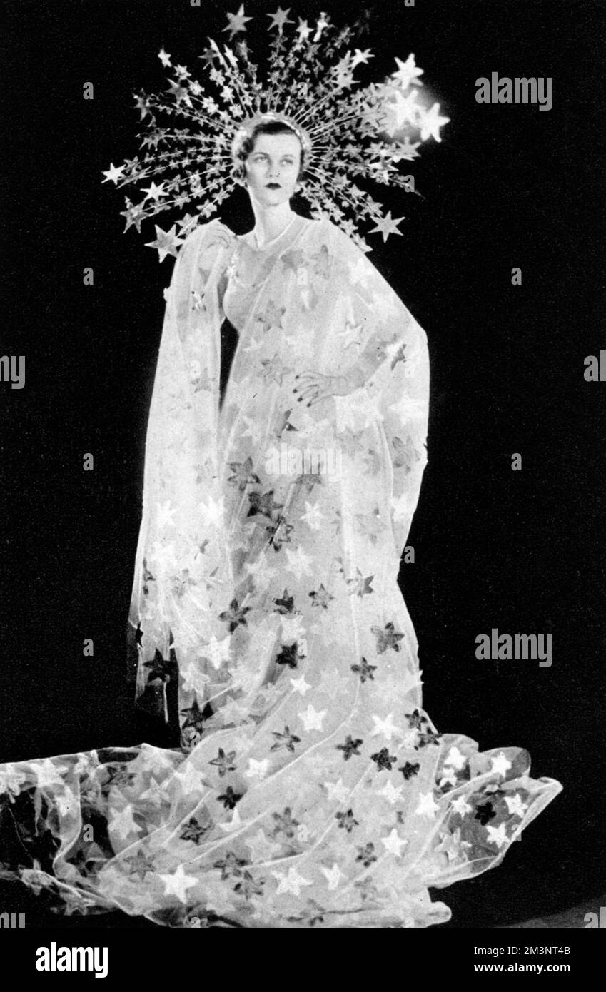 Mrs Charles Sweeny, formerly Miss Margaret Whigham and later the Duchess of Argyll (1912 - 1993), pictured as Astraea, the Star-Maiden for the Olympian Party at Claridges on 5 March 1935 in aid of the Greater London Fund for the Blind.  The Olympian Party featured a pageant of Olympians consisting of an entertainment of dancing and singing with orchestral accompaniment.     Date: 1935 Stock Photo