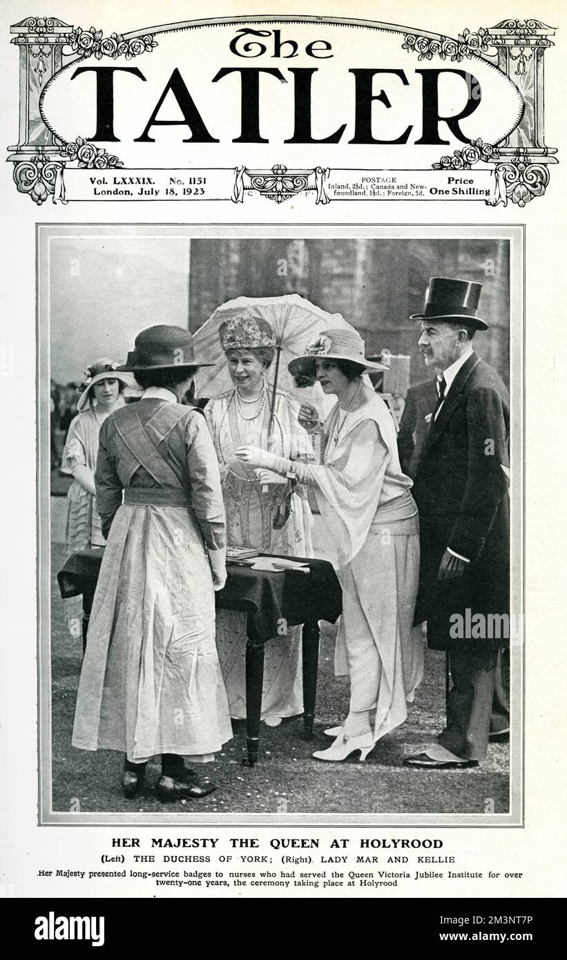 Her Majesty Queen Mary at Holyrood Castle with the Duchess of York (future wife of George VI and Queen Mother) and Lady Mar and Kellie, presenting badges to nurses who had served the Queen Victoria Jubilee Institute for over 21 years.      Date: 1923 Stock Photo