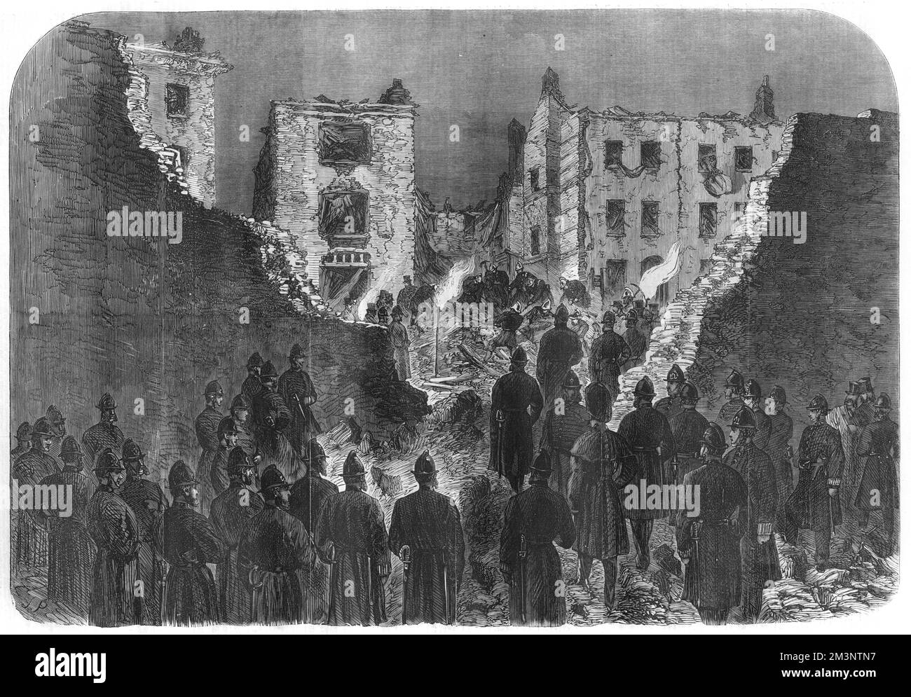 Effects of the explosion at the house of detention, Clerkenwell, seen from within the prison yard: police officers and firemen searching the ruins. The gunpowder explosion on the outer wall of Clerkenwell Prison was an attempt to free two Fenian prisoners, Richard Burke and Joseph Theobald Casey, who were imprisoned there. The explosion destroyed several houses in the neighbourhood, killed several people, including as the Illustrated London News says, &quot;two little children&quot;, and injured many more.     Date: 1867 Stock Photo
