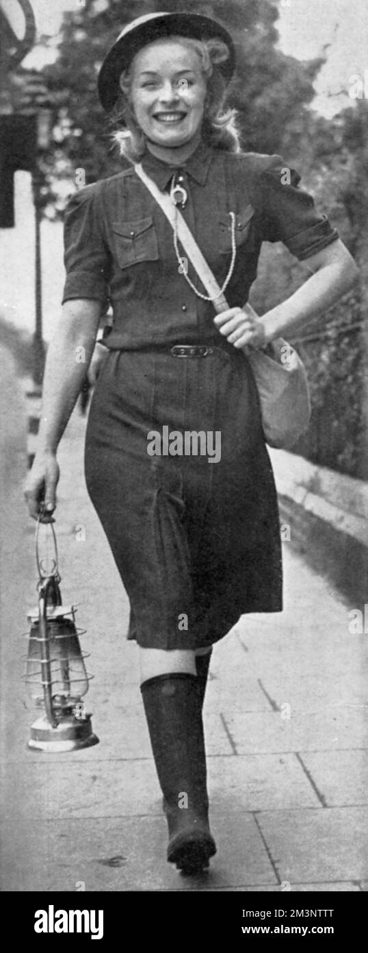 Miss Judy McCrea, a show girl at the Windmill Theatre, London fulfilling her other role as an air raid warden in Paddington in October 1939.       Date: 1939 Stock Photo