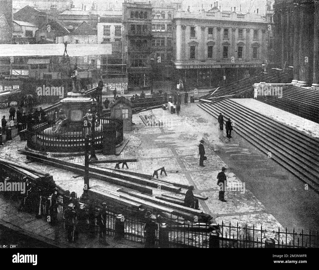 Preparations for the Diamond Jubilee service at St Paul's Cathedral. Viewing platforms are erected for the public to view the arrival of Queen Victoria. The Queen's carriage would draw up at the spot where the two figures are standing at the foot of the steps. The view is from the premises of Pawsons and Leafs, ladies clothing wholesale warehousemen     Date: June 1897 Stock Photo