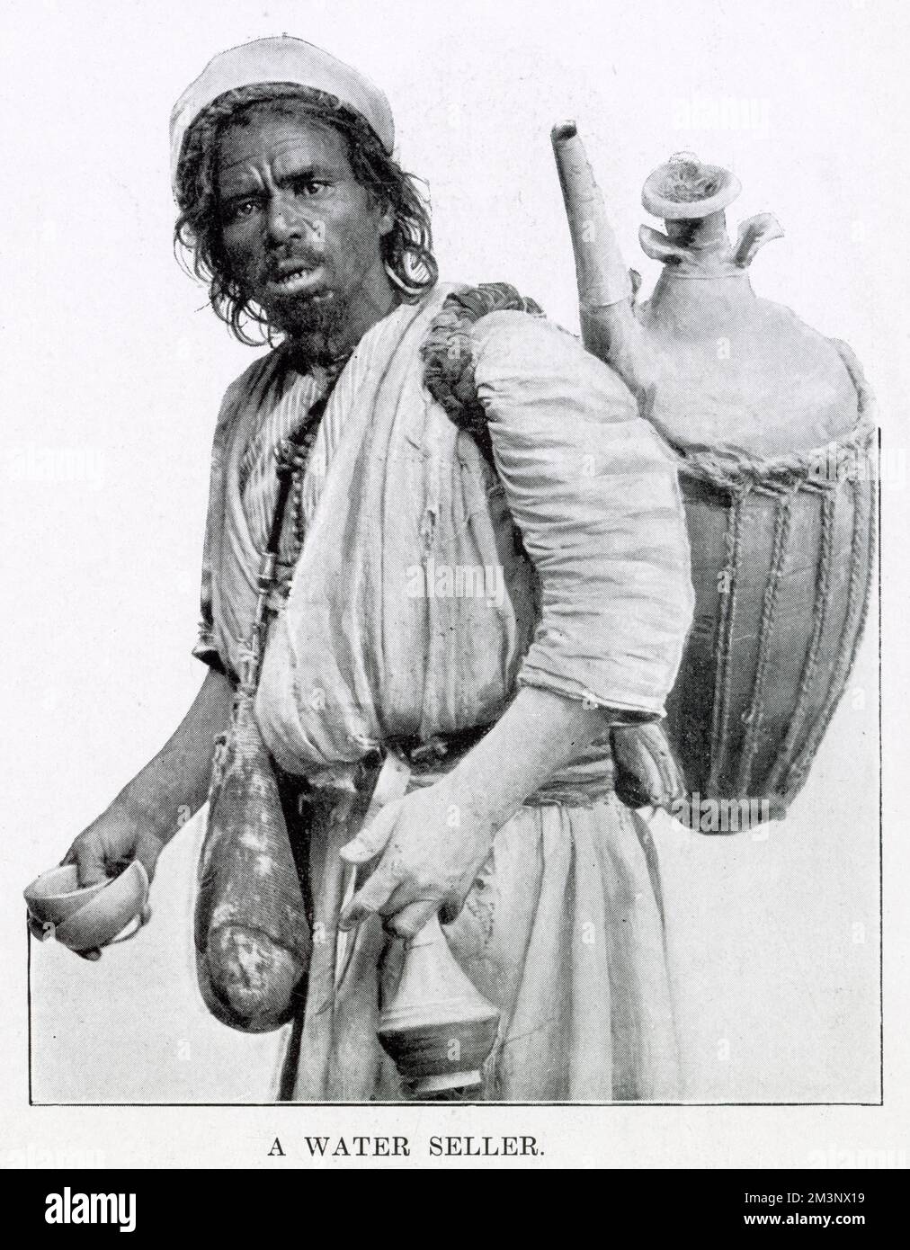 Egyptian man selling water from a clay jug on his back in Cairo, Egypt