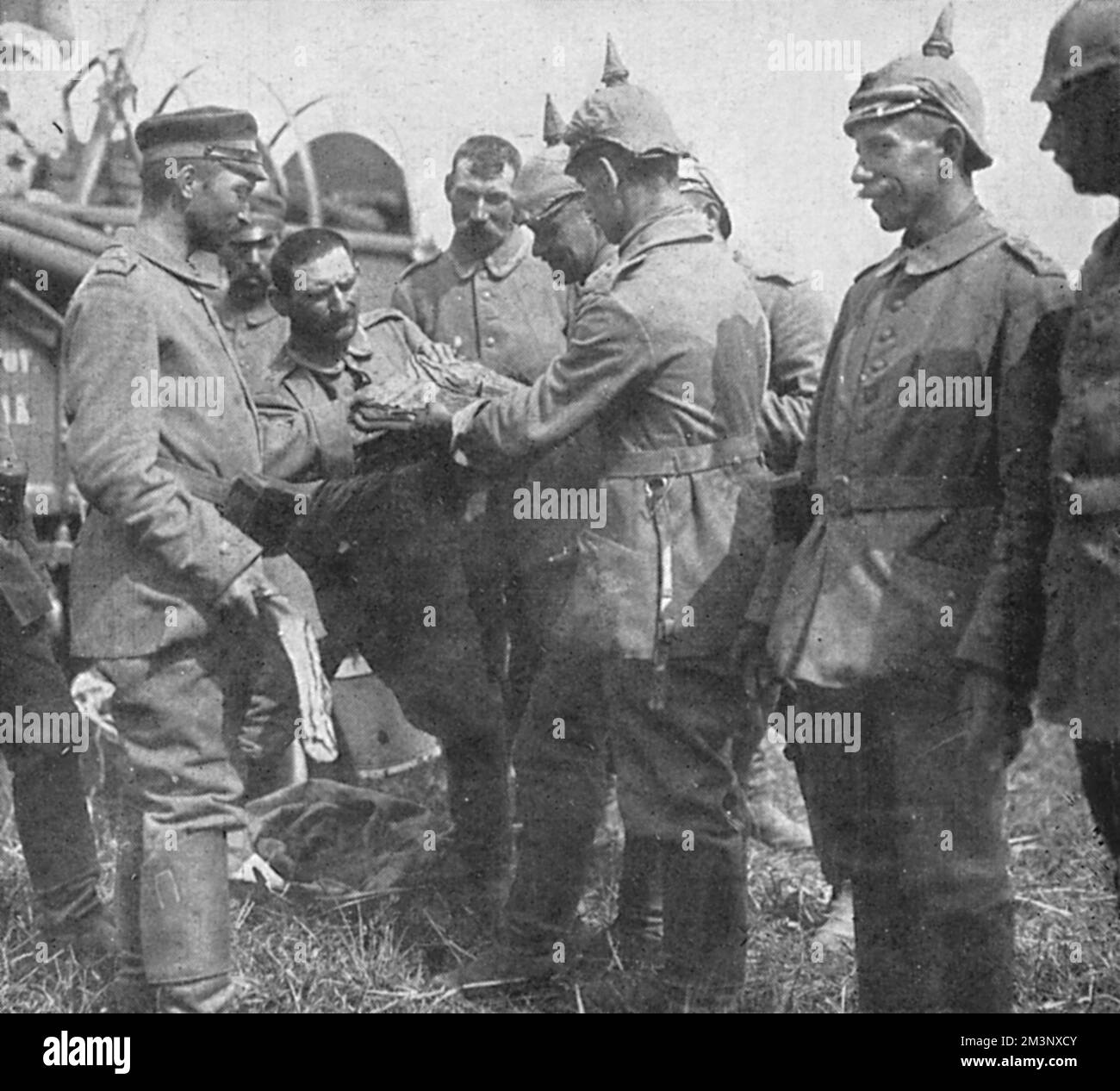 Rations of bread and ham are served out to German soldiers during a ...