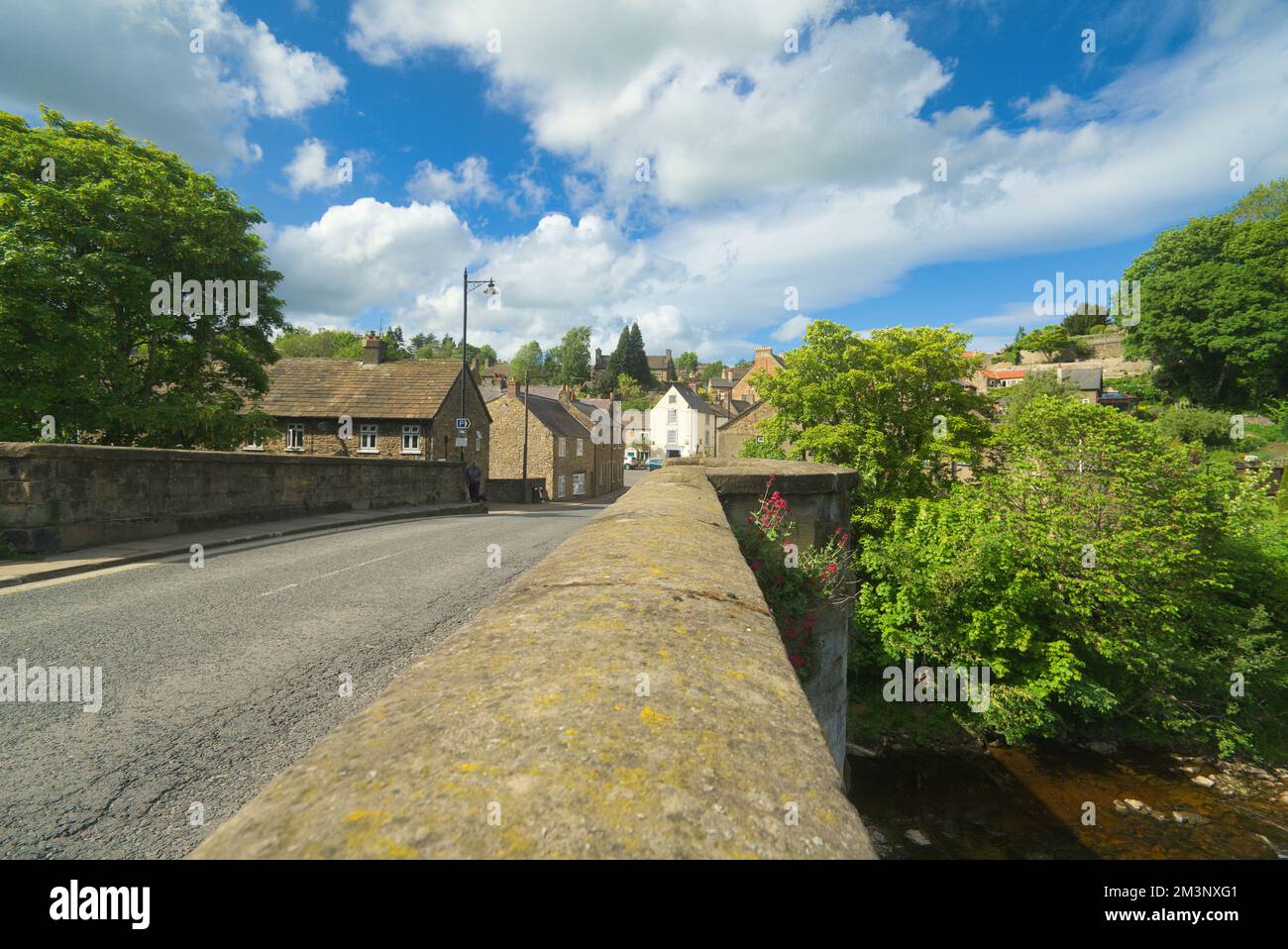 Richmond; River; Swale; old stone road Bridge on Bridge Street over river Swale. Looking North to    Richmond town, North Yorkshire England UK Stock Photo