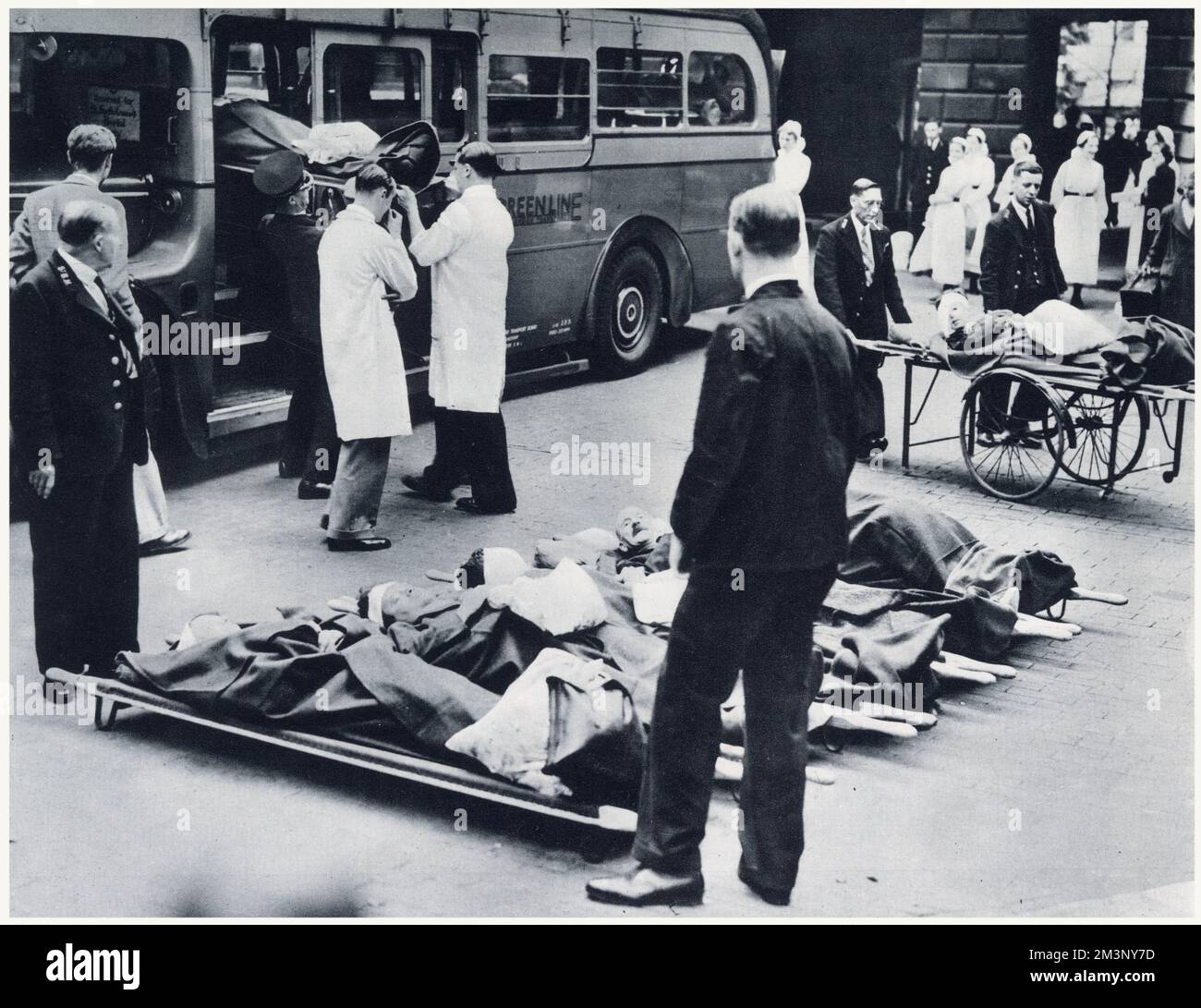 Evacuating hospital patients from a London hospital at the beginning of World War Two. For the evacuation of patients to the country, motor coaches were temporarily converted into motor ambulances. Stock Photo