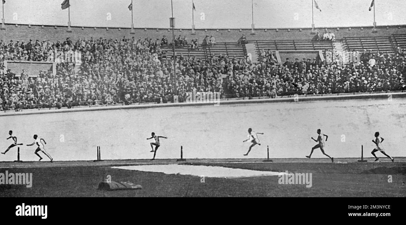 The final of the 400 metres hurdles at the 1928 Amsterdam Olympic Games, showing Lord Burghley silhouetted against the concrete banking of the stadium racing his way to a gold medal victory.  David George Brownlow Cecil, 6th Marquess of Exeter (1905 - 1981), Lord Burghley was an athlete, sports official and Conservative party politician.  As an athlete, Burghley was a very keen practitioner who placed matchboxes on hurdles and practised knocking over the matchboxes with his lead foot without touching the hurdle. In 1927, his final year at Magdalene College, Cambridge, he amazed colleagues by s Stock Photo
