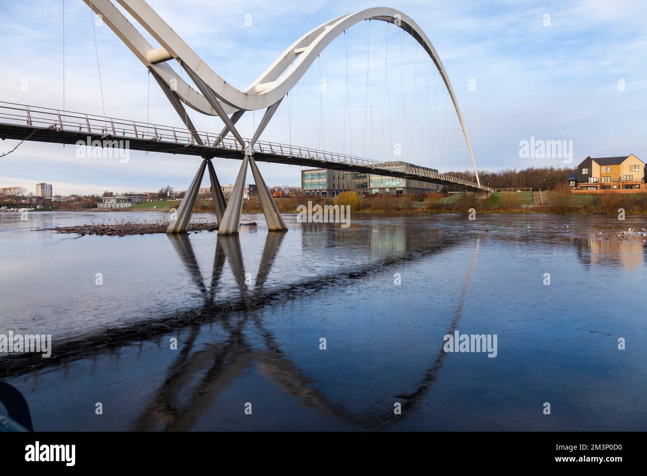 UK Weather.Stockton on Tees,UK 16th December 2022. The frozen waters of the River Tees at the Infinity Bridge. Children were still playing on a frozen pond in nearby Darlington despite warnings after the Solihull tragedy.  David Dixon / Alamy Stock Photo