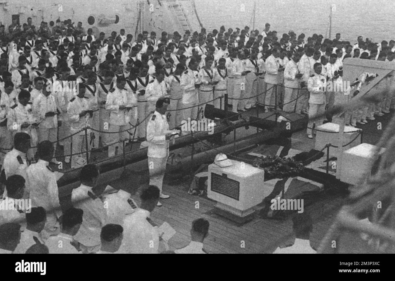 The loss of British submarine HMS Poseidon on 9th June 1931 after colliding with the Chinese merchant steamer SS Yuta : the memorial service aboard HMS Medway at Weihai (Poseidon's base in China) - survivors of the disaster in the first two ranks facing the camera.     Date: 1931 Stock Photo